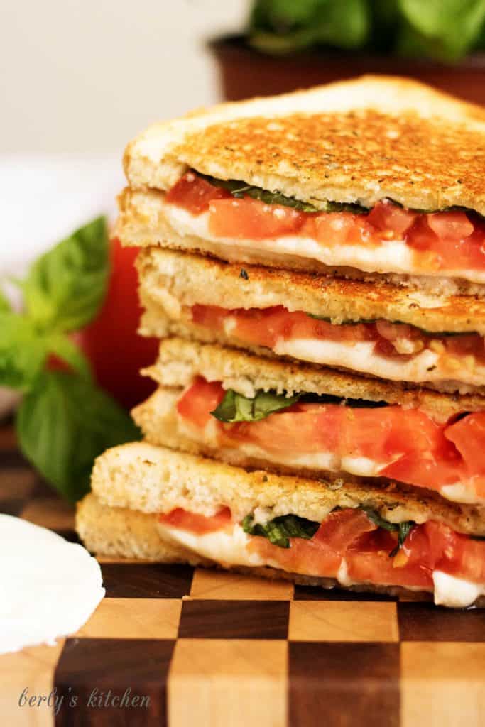 A margherita grilled cheese sandwich with perfectly toasted sourdough and all the flavors of the famous pizza including basil, mozzarella, and tomatoes.