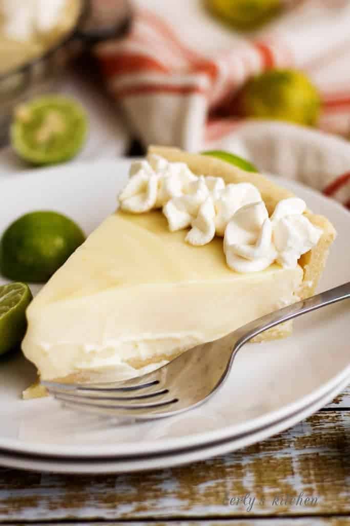 A homemade silky smooth key lime pie that's creamy, sweet, and tangy and is prepared with authentic key lime juice. It's the perfect for pie spring!