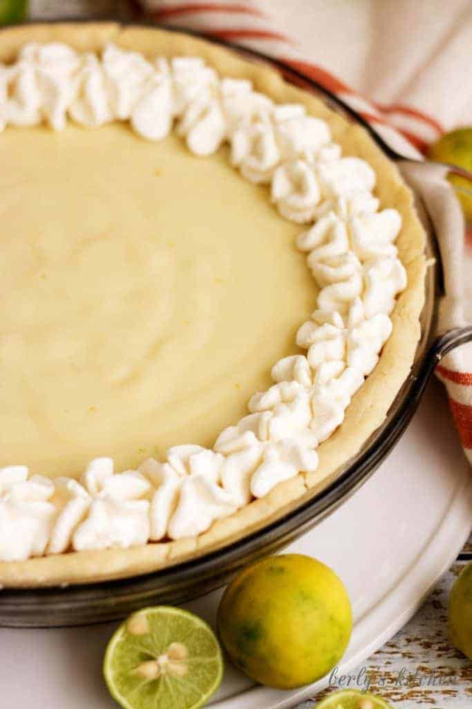 A homemade silky smooth key lime pie that's creamy, sweet, and tangy and is prepared with authentic key lime juice. It's the perfect for pie spring!