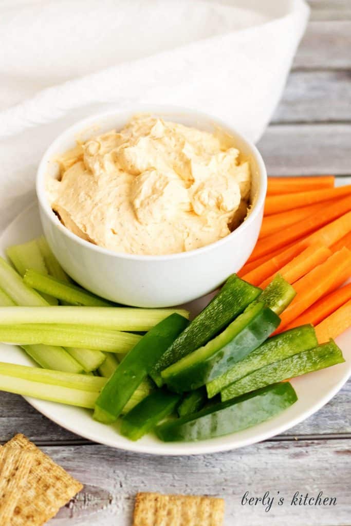 A creamy buffalo cheese spread made with cream cheese, hot sauce, and sour cream. It's the perfect spicy spread for crackers and vegetables.