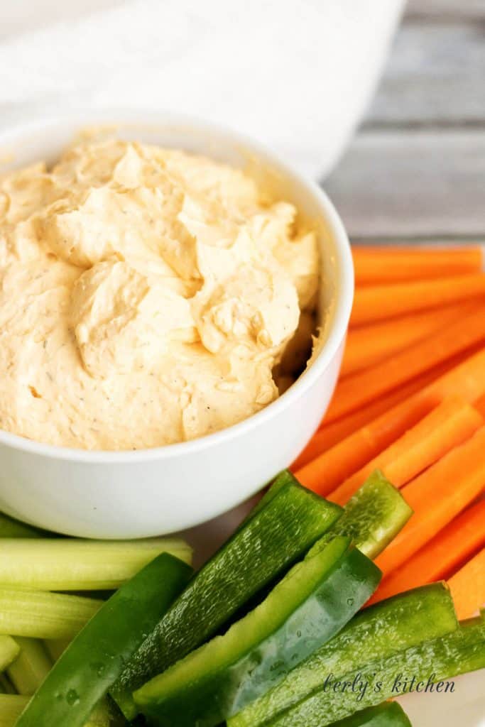 A creamy buffalo cheese spread made with cream cheese, hot sauce, and sour cream. It's the perfect spicy spread for crackers and vegetables.