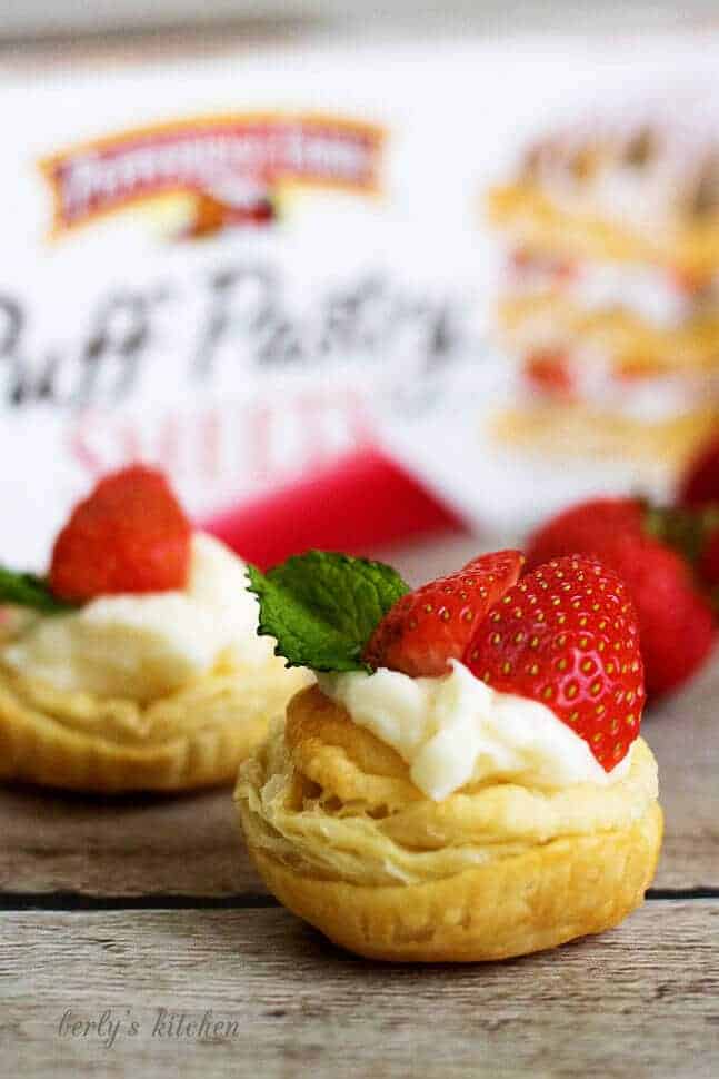 Strawberry Key Lime Cups topped with fresh strawberries.