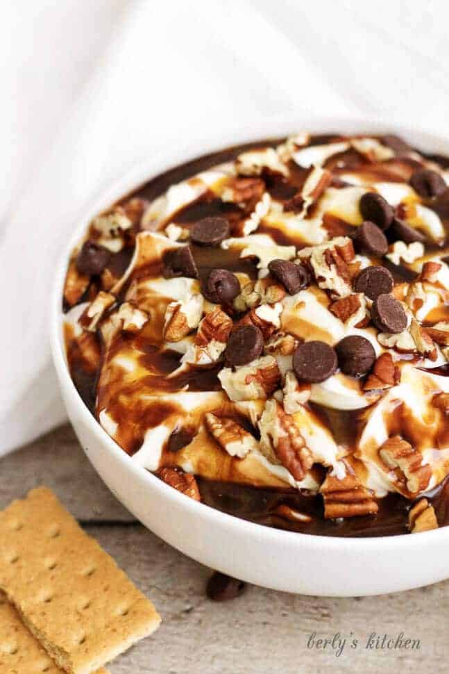 This tempting turtle cheesecake has all the flavor of your favorite creamy dessert including cream cheese, chocolate, caramel, and pecans.