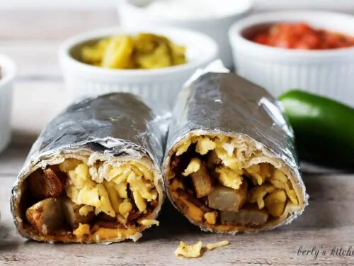 A hearty and filling make ahead breakfast burrito recipe with bacon, eggs, potatoes, and cheese wrapped in a warm tortilla.