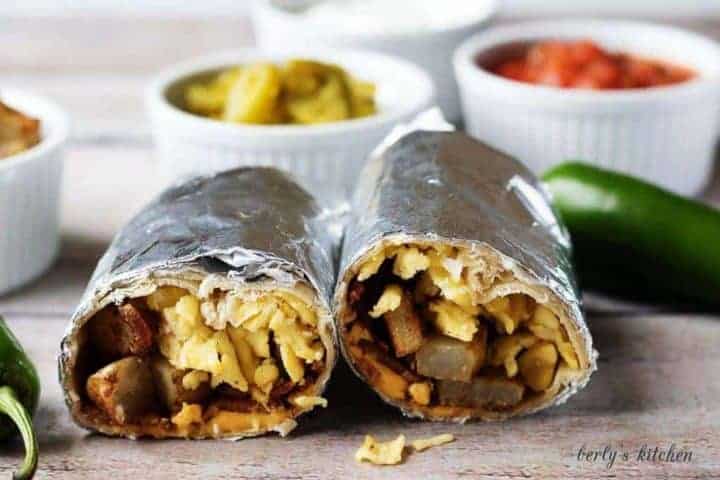 A hearty and filling make ahead breakfast burrito recipe with bacon, eggs, potatoes, and cheese wrapped in a warm tortilla.