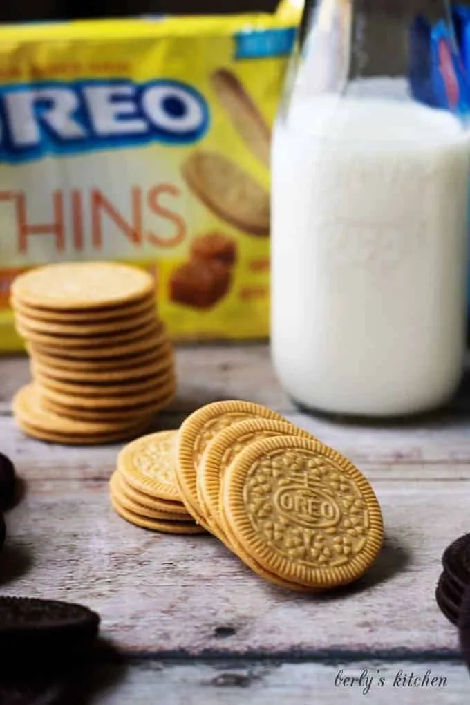 Stack of salted caramel OREOs with milk.
