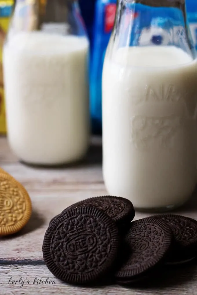 Pile of coconut OREOs with milk.