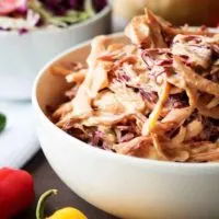 A unique spicy coleslaw recipe made with four ingredients and loaded with flavor. It's simple to prepare and is used to top your favorite sandwich or taco.