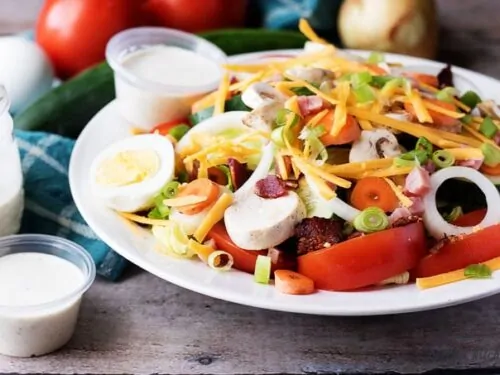 Our copycat classic diner chef salad is a throwback to that perfect entree you just can't seem to find anymore. It's loaded with cheese, ham, and bacon!