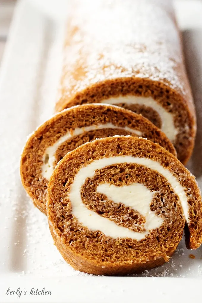 Grandma's Pumpkin Roll is one of my family’s favorite fall recipes.  Sweetened cream cheese filling rolled in a light, and moist pumpkin cake makes this dessert unforgettable.