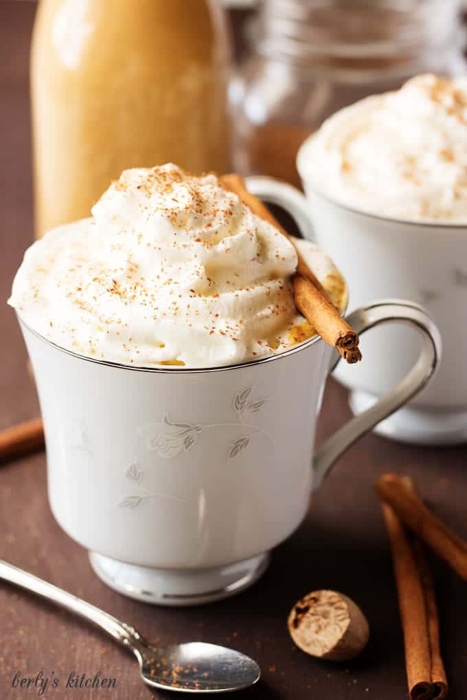 Coffee mixed with pumpkin spice creamer in cups.