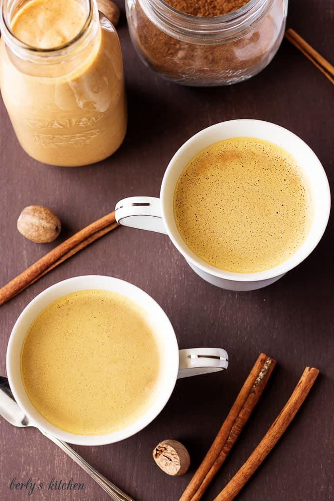 Top down view of flavored coffee in mugs.