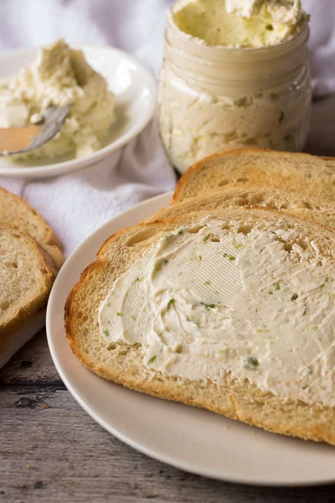 Close up of compound butter on sliced bread.