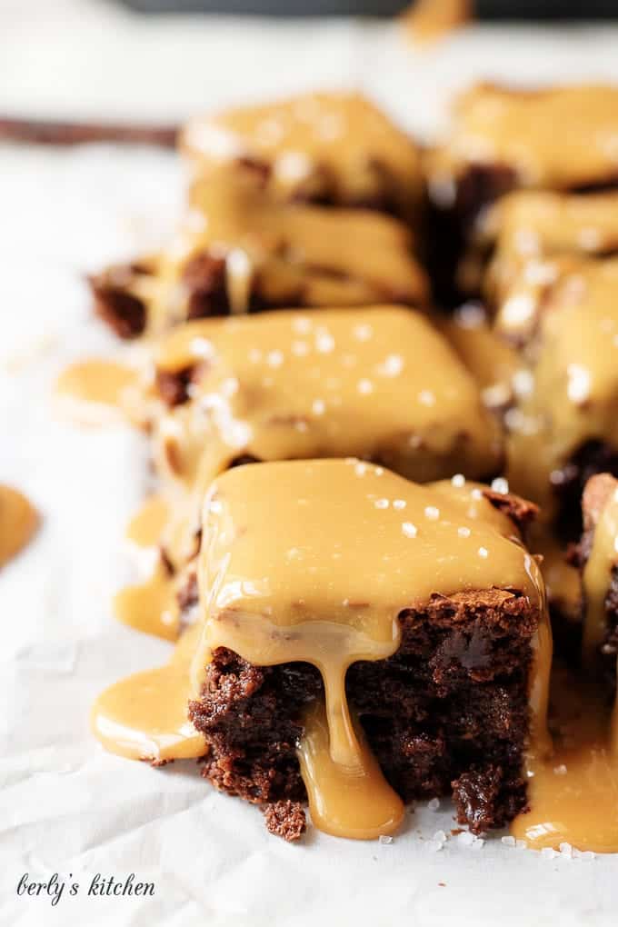 Brownies dripping with caramel sauce.