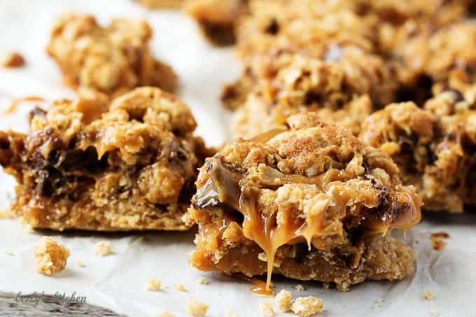 Ooey, gooey, and dripping with caramel, chocolate oat carmelita bars are the way to satisfy any sweet tooth.  who can resist a layer of melted caramel and chocolate sandwiched between a shortbread crust and oatmeal topping?