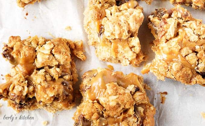 Ooey, gooey, and dripping with caramel, chocolate oat carmelita bars are the way to satisfy any sweet tooth.  who can resist a layer of melted caramel and chocolate sandwiched between a shortbread crust and oatmeal topping?