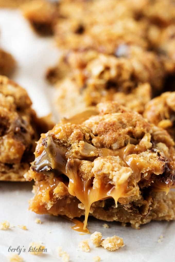 Ooey, gooey, and dripping with caramel, Chocolate Oat Carmelita Bars are the way to satisfy any sweet tooth.  Who can resist a layer of melted caramel and chocolate sandwiched between a shortbread crust and oatmeal topping?