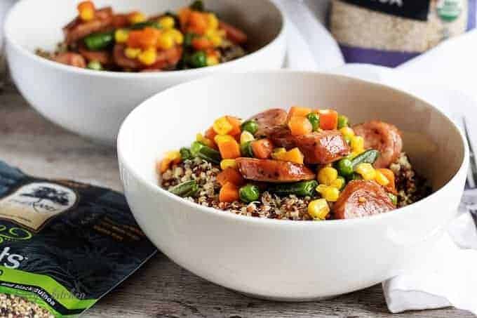 Quinoa and veggies in a white bowl.