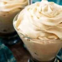 Irish Cream Flavored Whipped Cream in two cocktail glasses with blue towels.