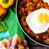 Choziro hash topped with eggs in a skillet.