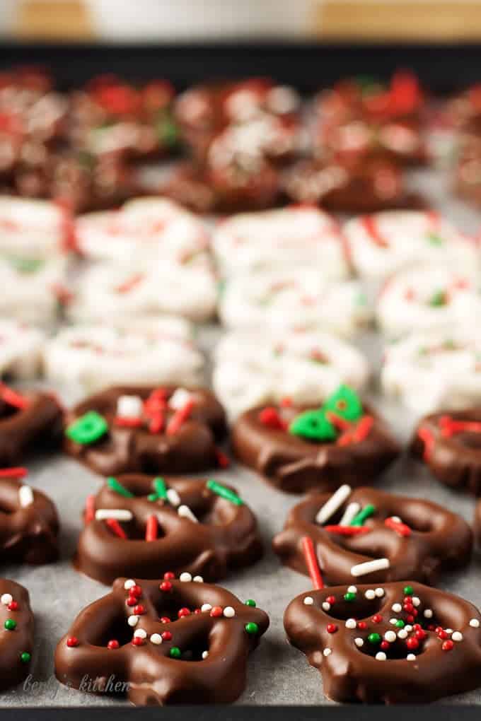 A close-up view of the dark chocolate covered pretzels recipe with Christmas sprinkles. 
