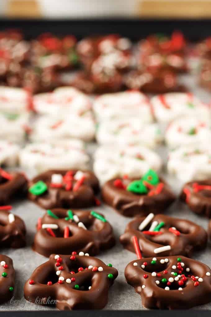 A close-up view of the dark chocolate covered pretzels recipe with christmas sprinkles.