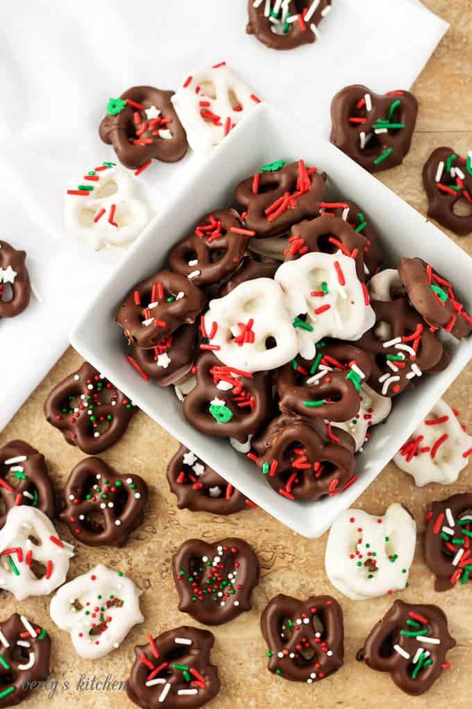 The final top-down view of the white and dark chocolate dipped pretzels in a white bowl.