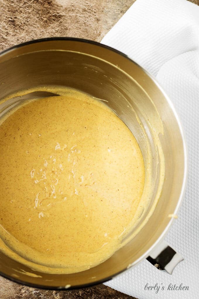 A top-down view of the eggnog cupcakes batter in large mixing mixing bowl.