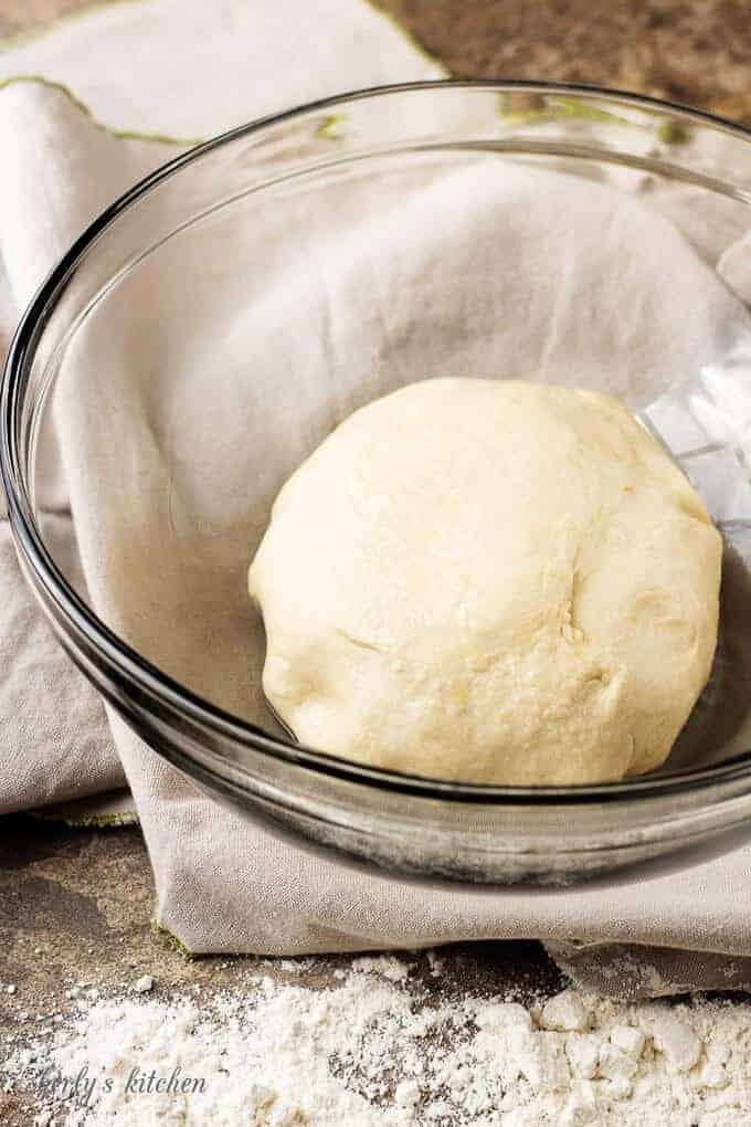 A photo of the mixed dough in glass mixing bowl before rising.