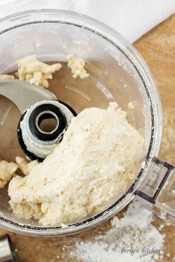 Homemade buttermilk biscuit dough in a food processor.