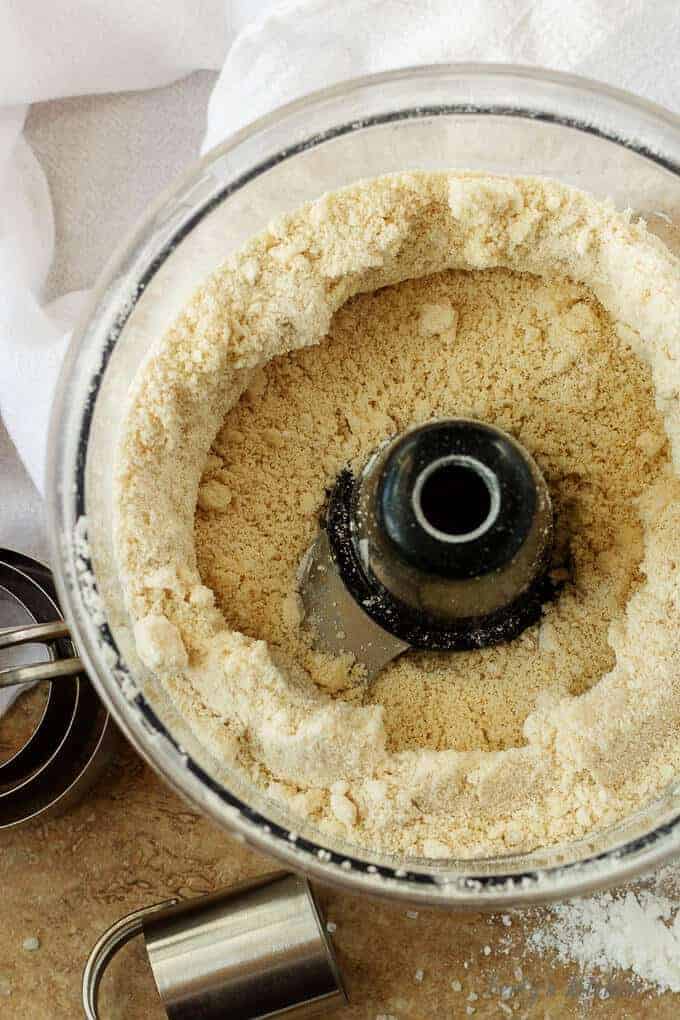 Ariel view of homemade buttermilk biscuit ingredients mixed in a food processor.