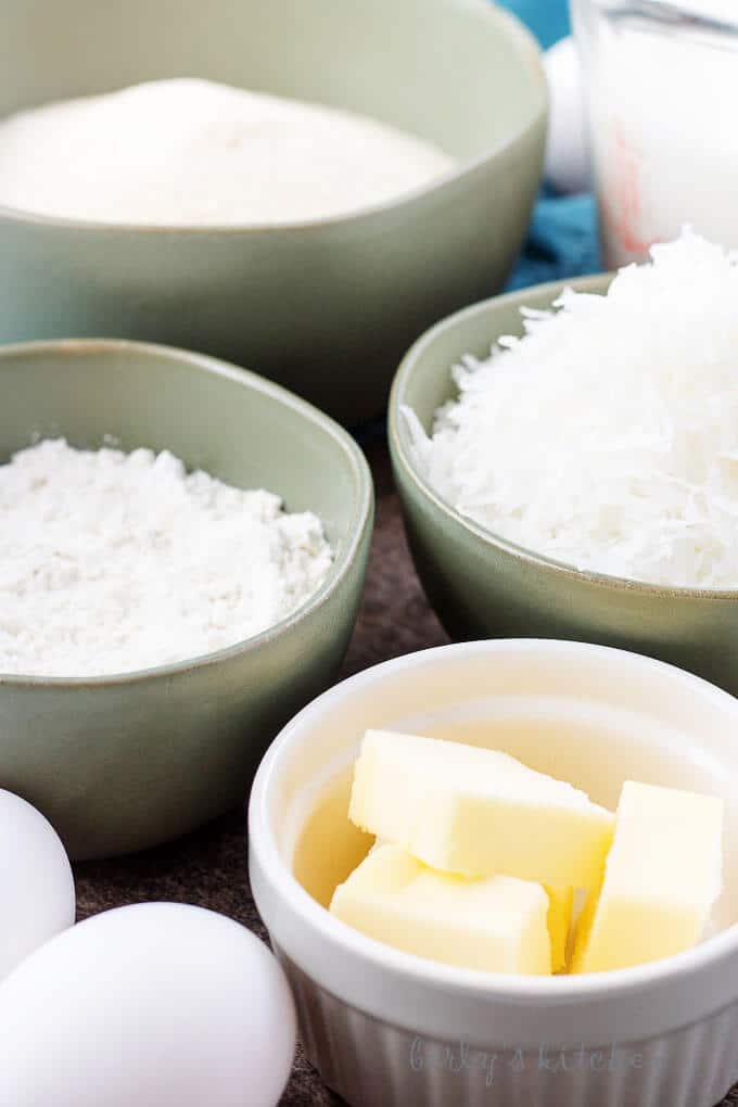 Sugar, milk, coconut, flour, eggs, and butter used to make coconut custard pie.