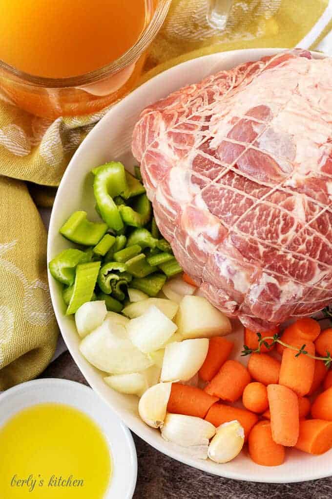 Pork roast, celery, carrot, onion, garlic, thyme, broth used for pork pot roast.