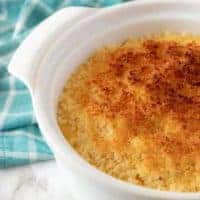 An aerial photo of the funeral potatoes, in a white dish, ready to be served.