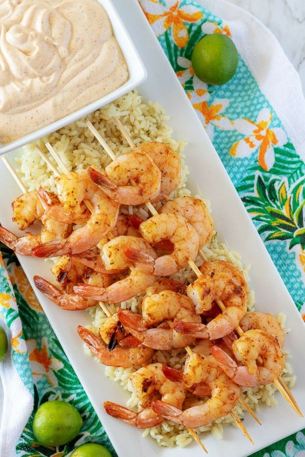 A top-down photo of the grilled shrimp over a bed of cilantro rice, served with key lime aioli.