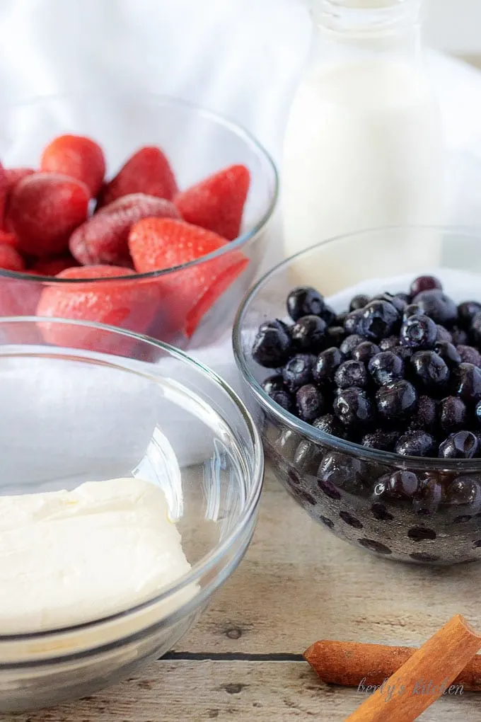 All the parfait ingredients likes frozen blueberries and strawberries along with cream cheese.