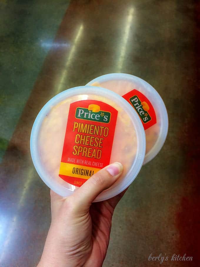 A close-up photo of the pimento cheese spread showing the package branding.