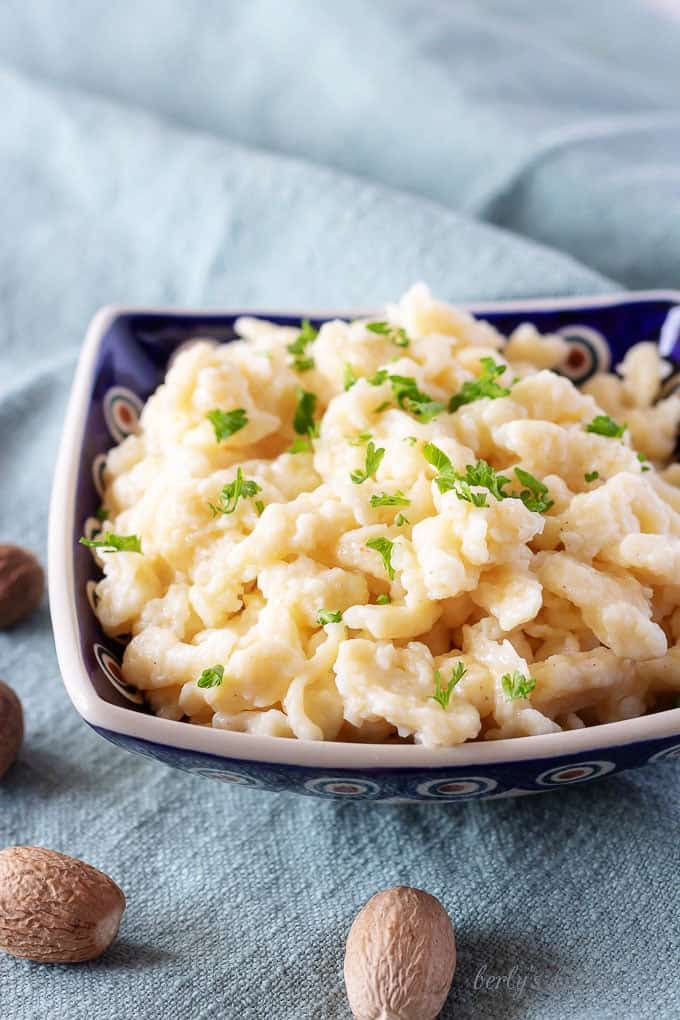 A picture showing a close-up view of the finished spaetzle recipe in a traditional Polish hand painted bowl.