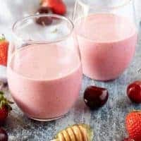 A large picture of the berry smoothies in a glasses on display.