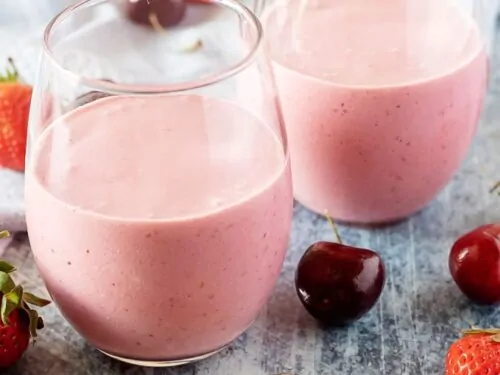 A large picture of the berry smoothies in a glasses on display.