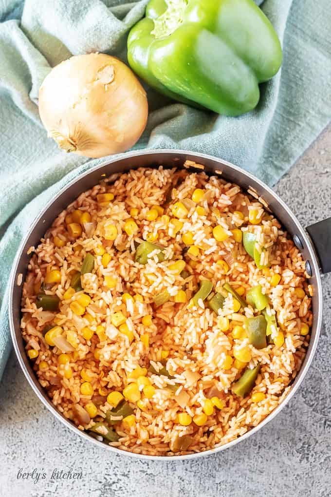 An aerial photo of the mexican rice cooked in a medium saucepan.