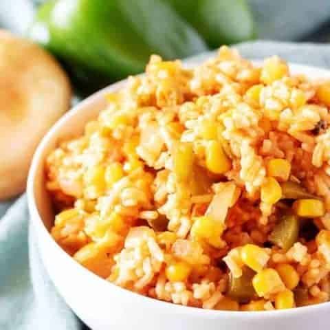 Mexican Rice Recipe A close-up view of the finished mexican rice in white bowl for serving.