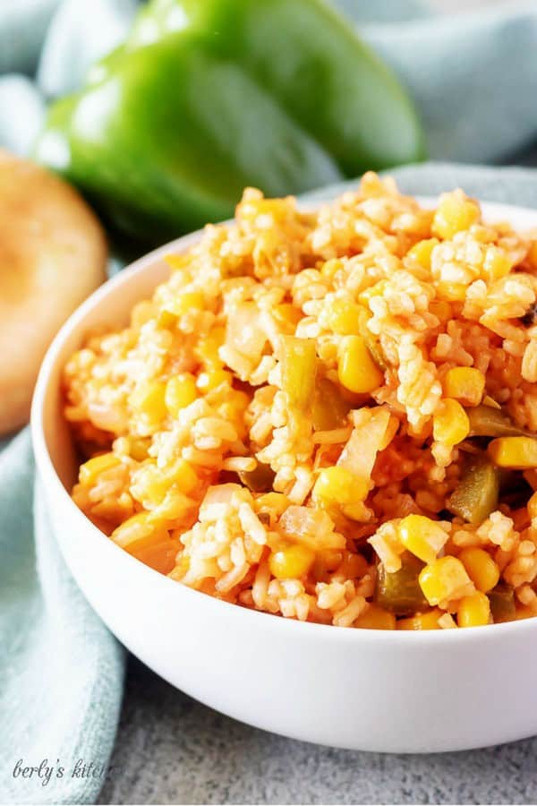 A large photo of the finished Mexican rice in a white bowl.