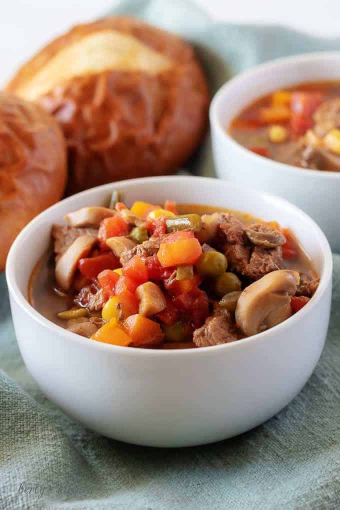 A close-up view of the finished vegetable beef soup in white bowl.