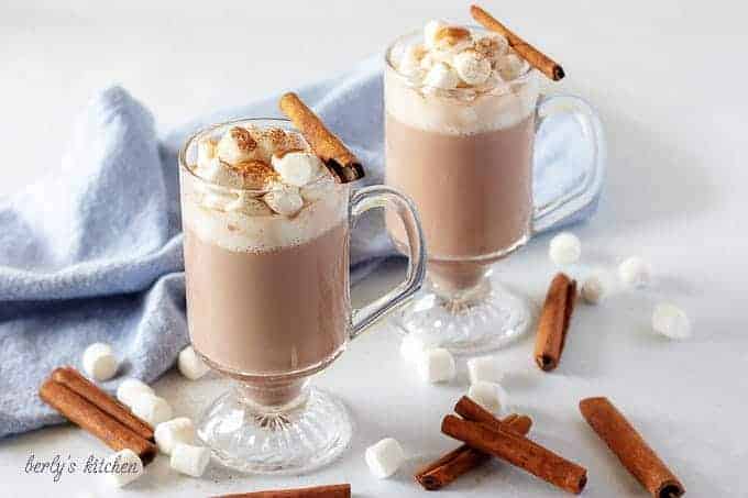 The finished spiked hot cocoa in a glass mug, topped with marshmallows. 