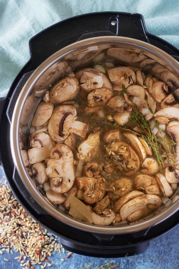 An aerial view of the ingredients in the instant pot just before the roux is added to the soup.