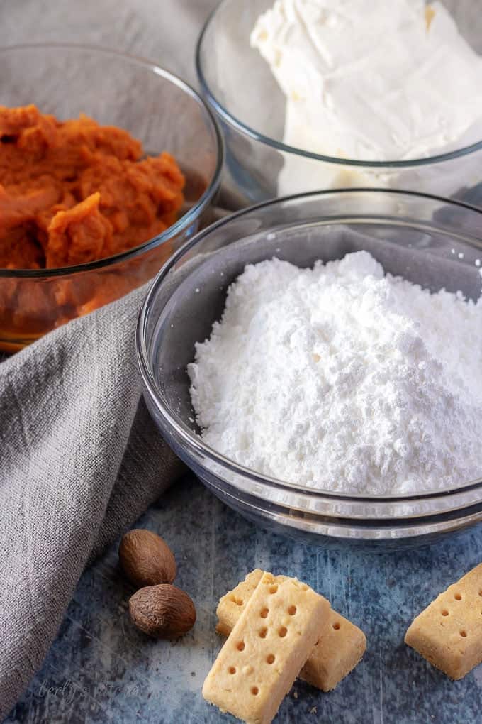 The pumpkin dip ingredients, like canned pumpkin, powdered sugar, and pumpkin pie spice.