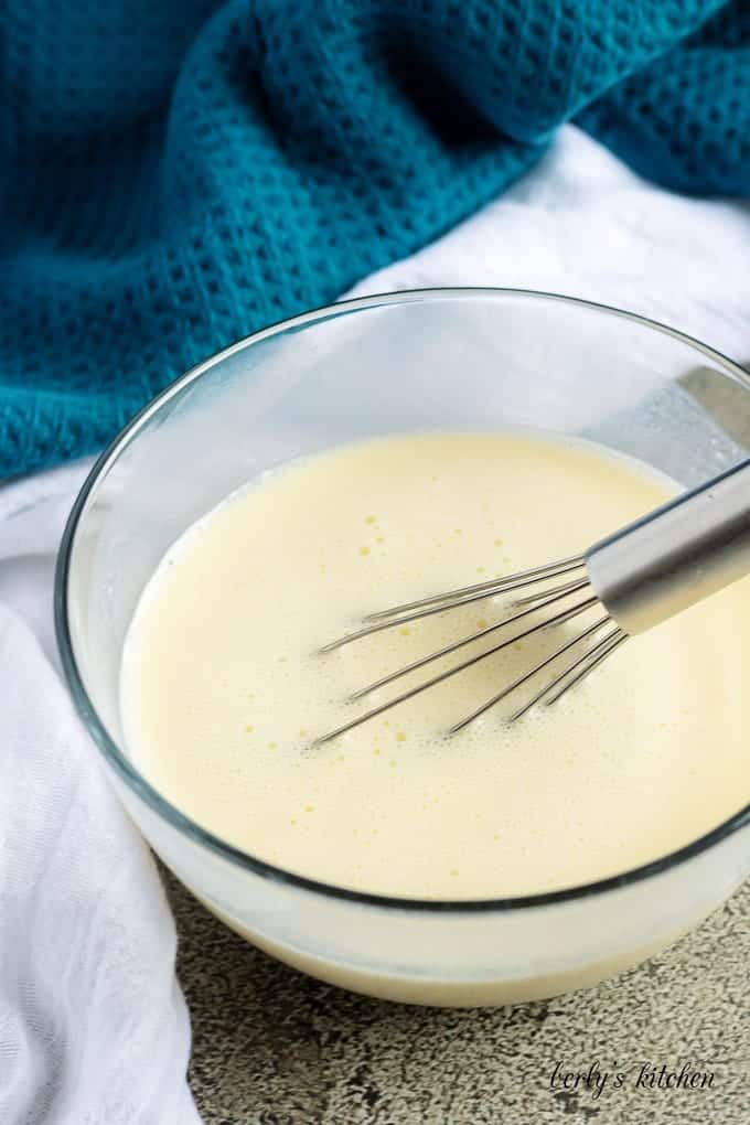 Milk, buttermilk, and egg mixed together for buttermilk cornbread.