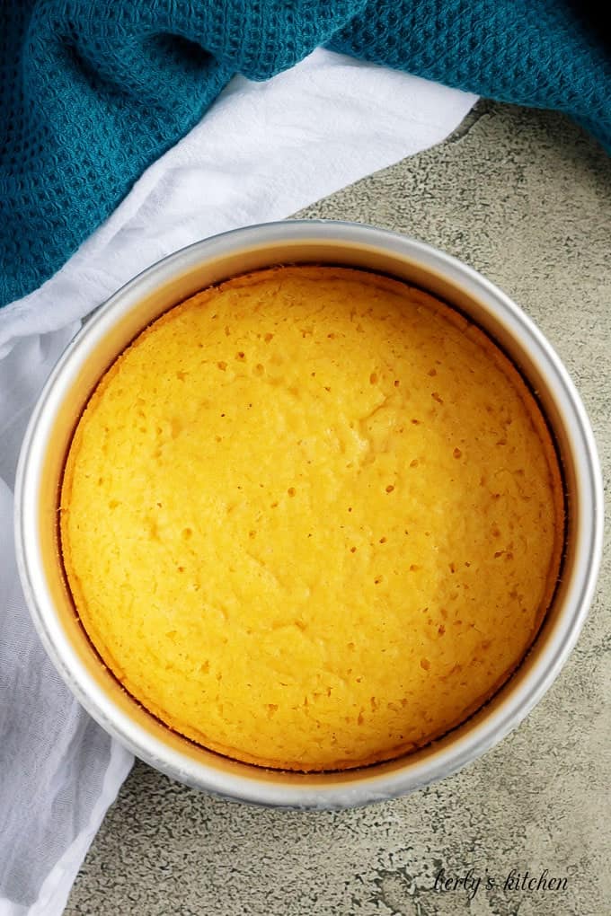 Arial view of cooked buttermilk cornbread in a cake pan.