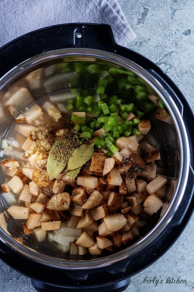 A second aerial photo of the ingredients in the pressure cooker, ready to be sealed.